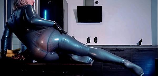 sexy curvy MILF Arya Grander fetish model posing in latex rubber catsuit